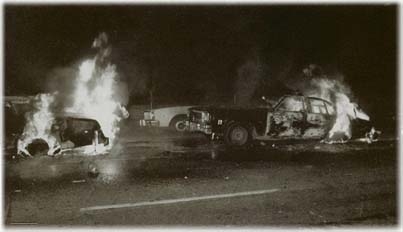 burning cop cars white night riot.JPG